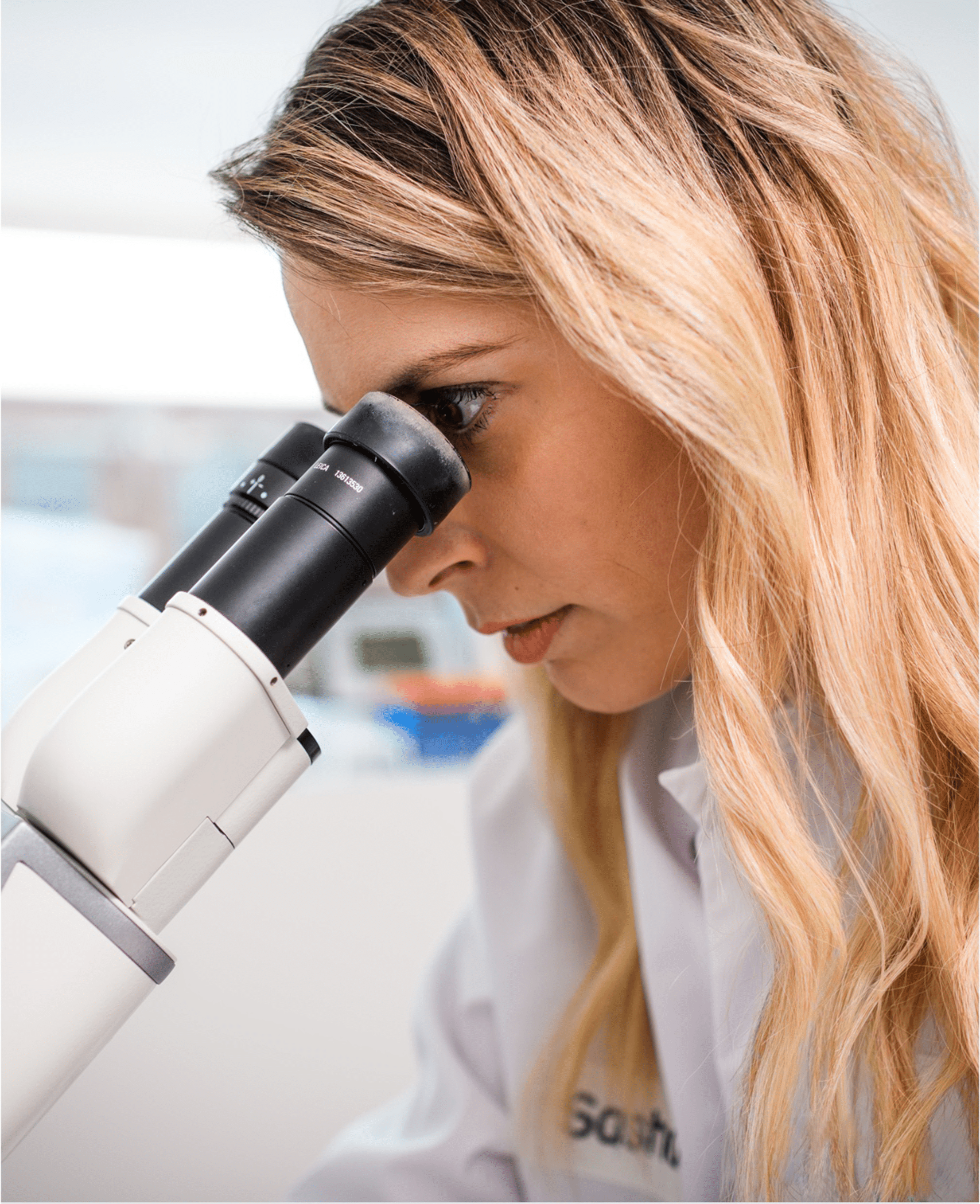 sasha-looking-thru-microscope@2x Creating targeted cellular therapies that address the complexities of the immune system and its various types of cells